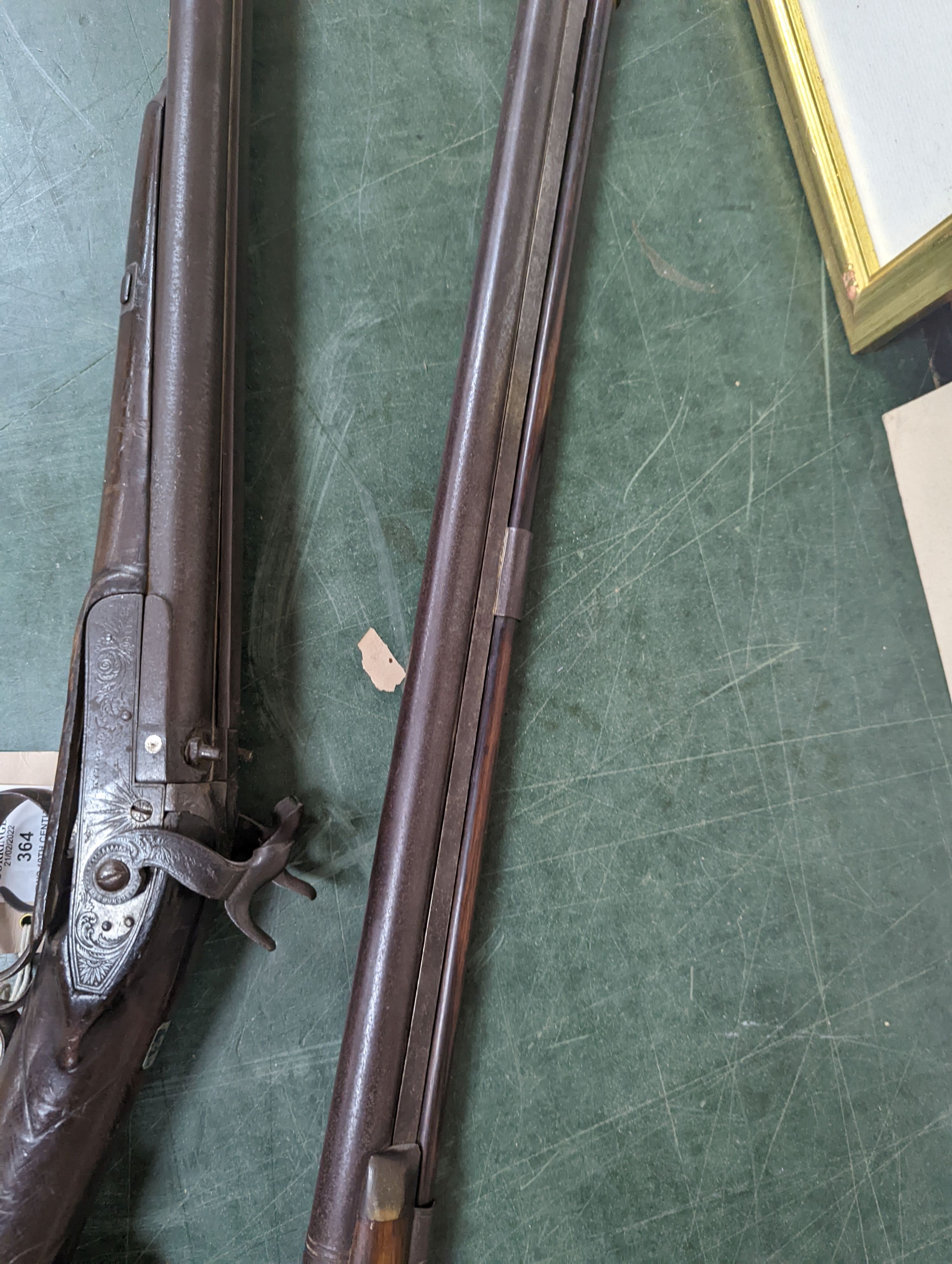 Two 19th century percussion muskets, 103cm. max., one double-barrelled